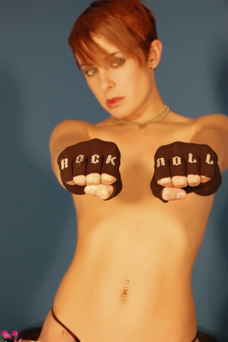 Natural redhead Brittany Avalon takes off a a hoodie in a thong and boots 24612865