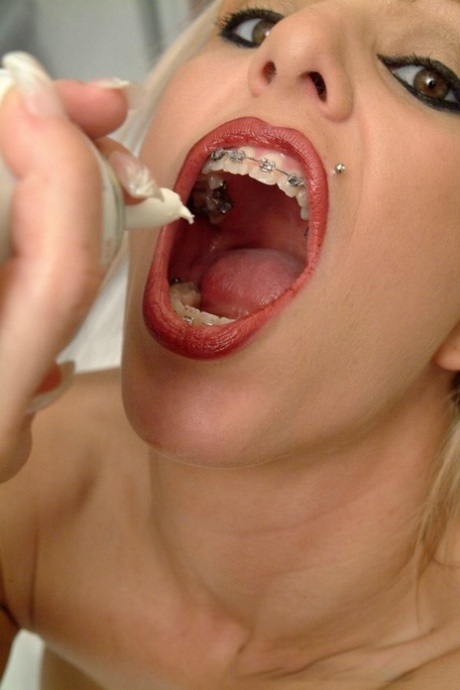 Blonde chick Kream shows her braces while filling her mouth with whipped cream 38098962