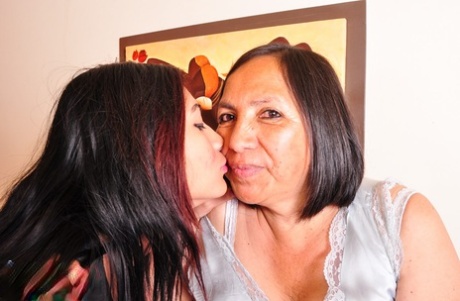 Latina granny Andrea has lesbian sex on a bed with a young girl 93126799