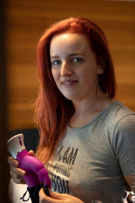 Amateur redhead Charlie Forde masturbates with a vibrator after undressing 61059408
