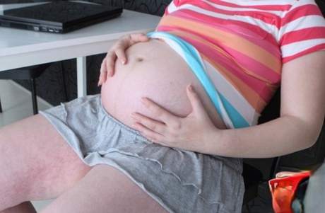 Pregnant blonde feels the sudden urge to get naked and masturbate 79398688