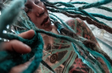 Tattooed body modifier Illuz whips her dreadlocks about while bare naked 54370153