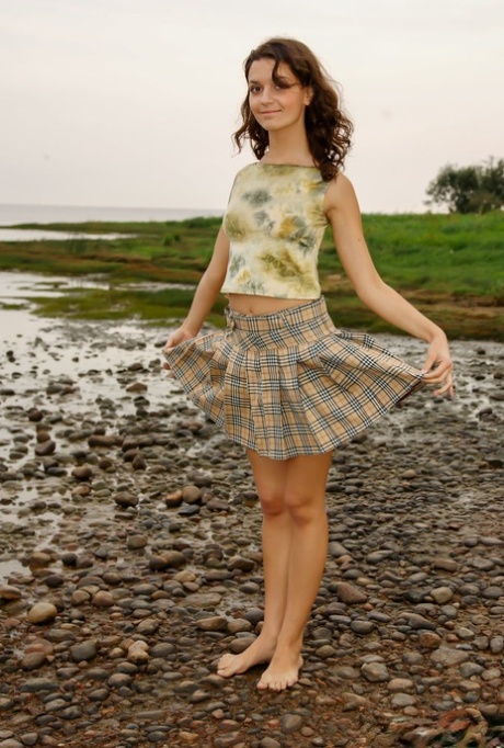 Skinny 18-year-old Roza A works her tight ass during nude waterside action 42241975