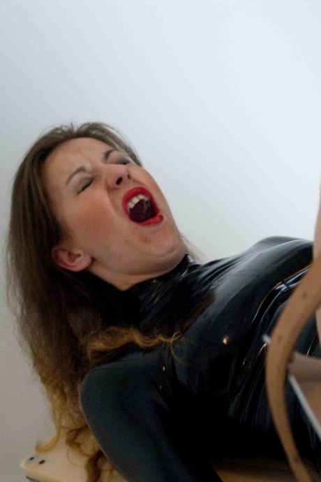 Bottomless female sex slave is machine fucked while strapped to gyno chair 10406543